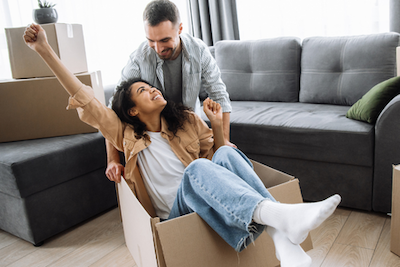 couple together with lady in box and man holding box