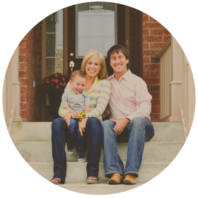 family sitting on front porch