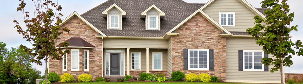 PICTURE OF THE FRONT OF A TWO STORY HOUSE RANCH STYLE
