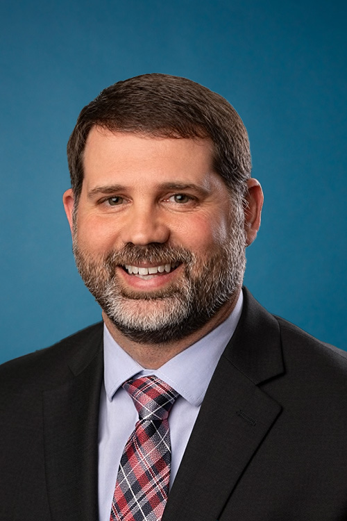 Image of Michael Dennis in business attire