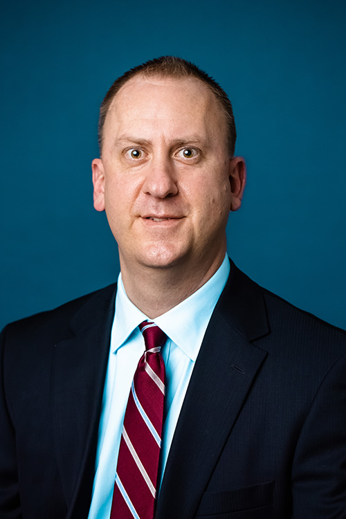 Image of Cory Helmer in business attire