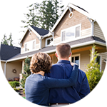 Married couple looking at their new house - refinance
