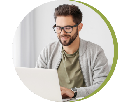 A young man uses a computer.