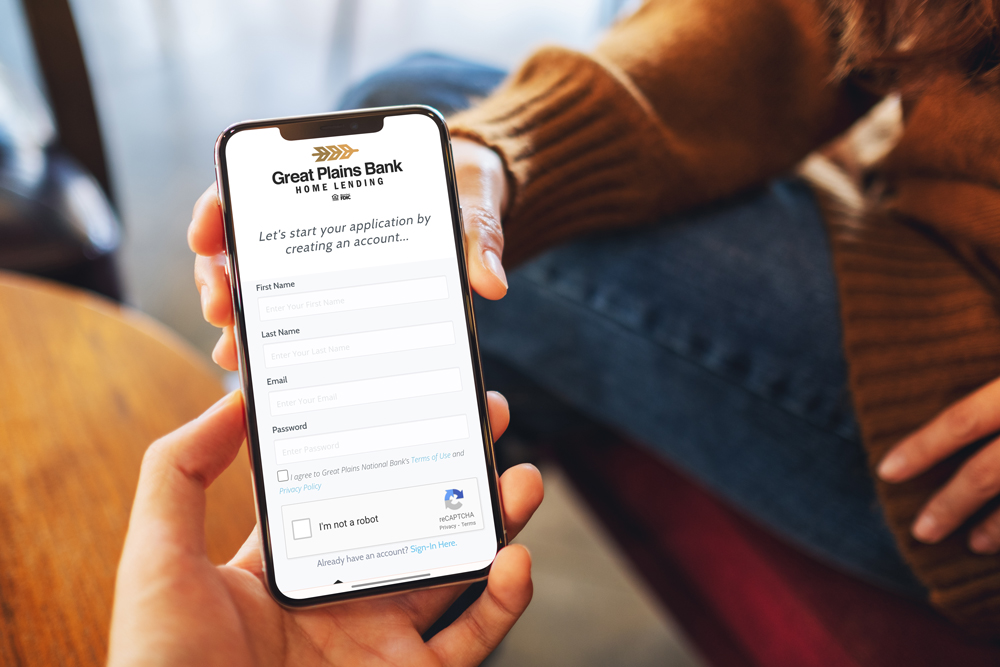 Holding mobile phone. Mobile mortgage application